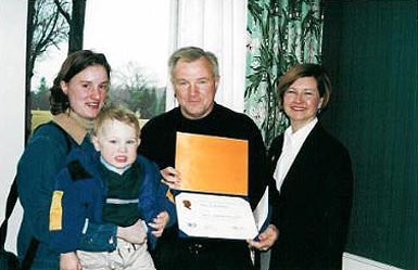 On February 21, 2002, Paul Murphy was recognized as a Paul Harris Fellow for Rotary International. Part of Pauls family attended the Award Ceremony. On the picture you can see Paul with his daughter, grandson and wife.